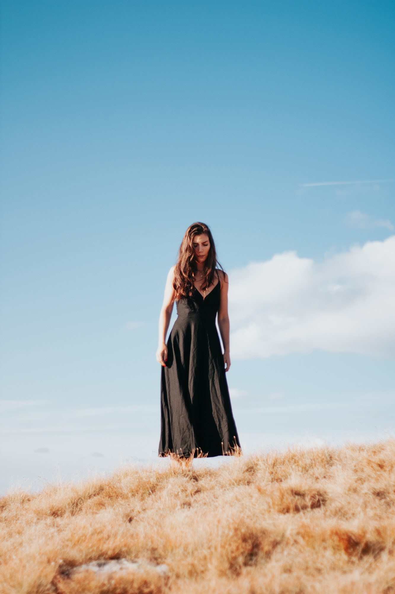Woman walking barefoot in the grass